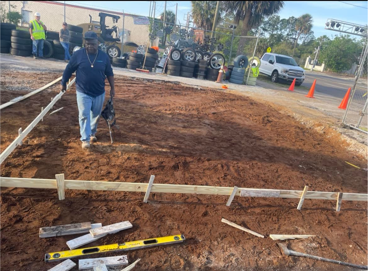 Workers from Ernest Concrete preparing to pour a concrete slab