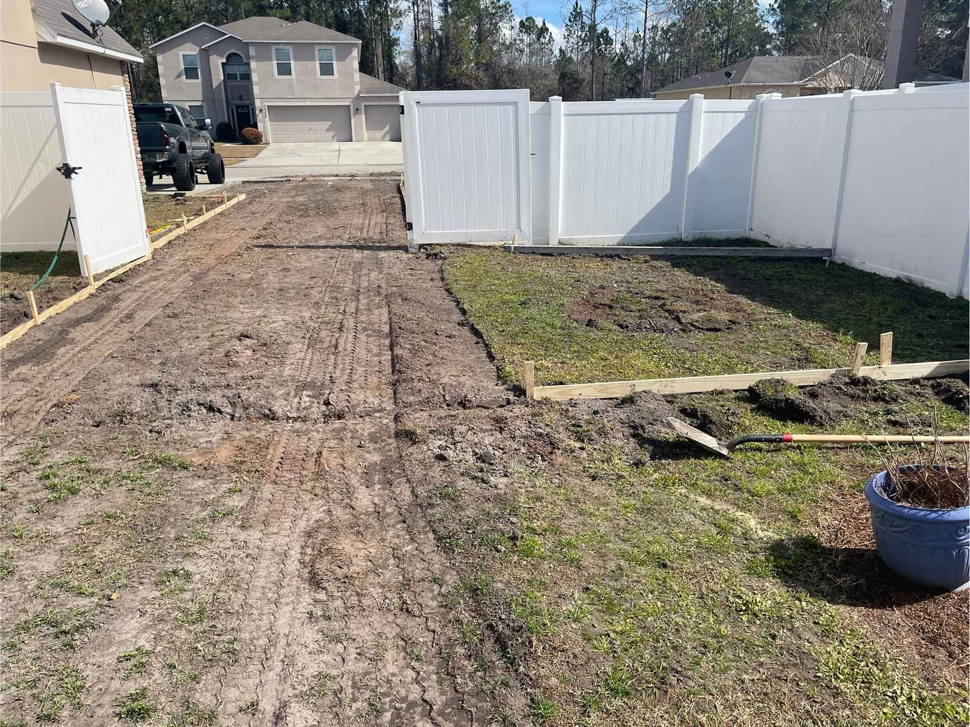 Land graded and prepared for concrete driveway pouring